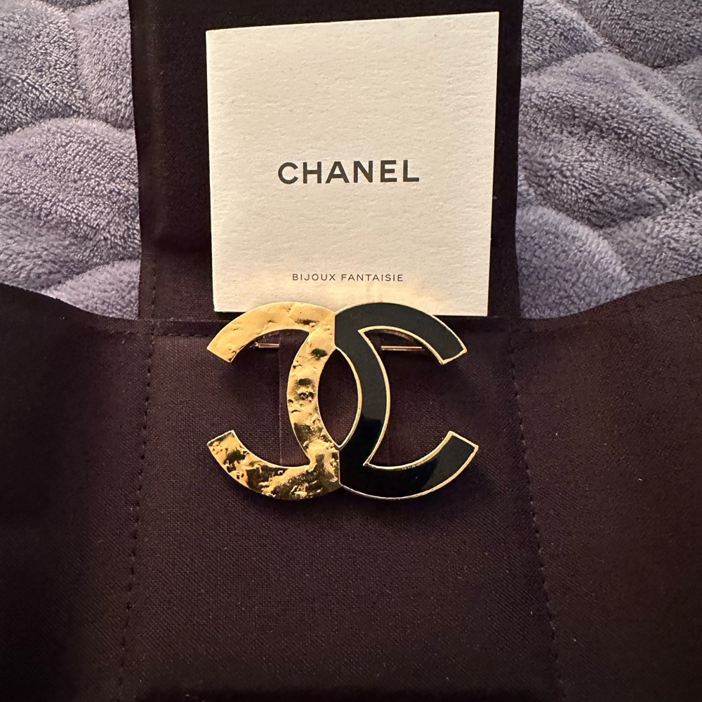 CHANEL Gold and Black Interlocking Logo Brooch